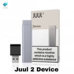 Juul 2 Device with USB charger in slate grey color alongside packaging with nicotine warning label